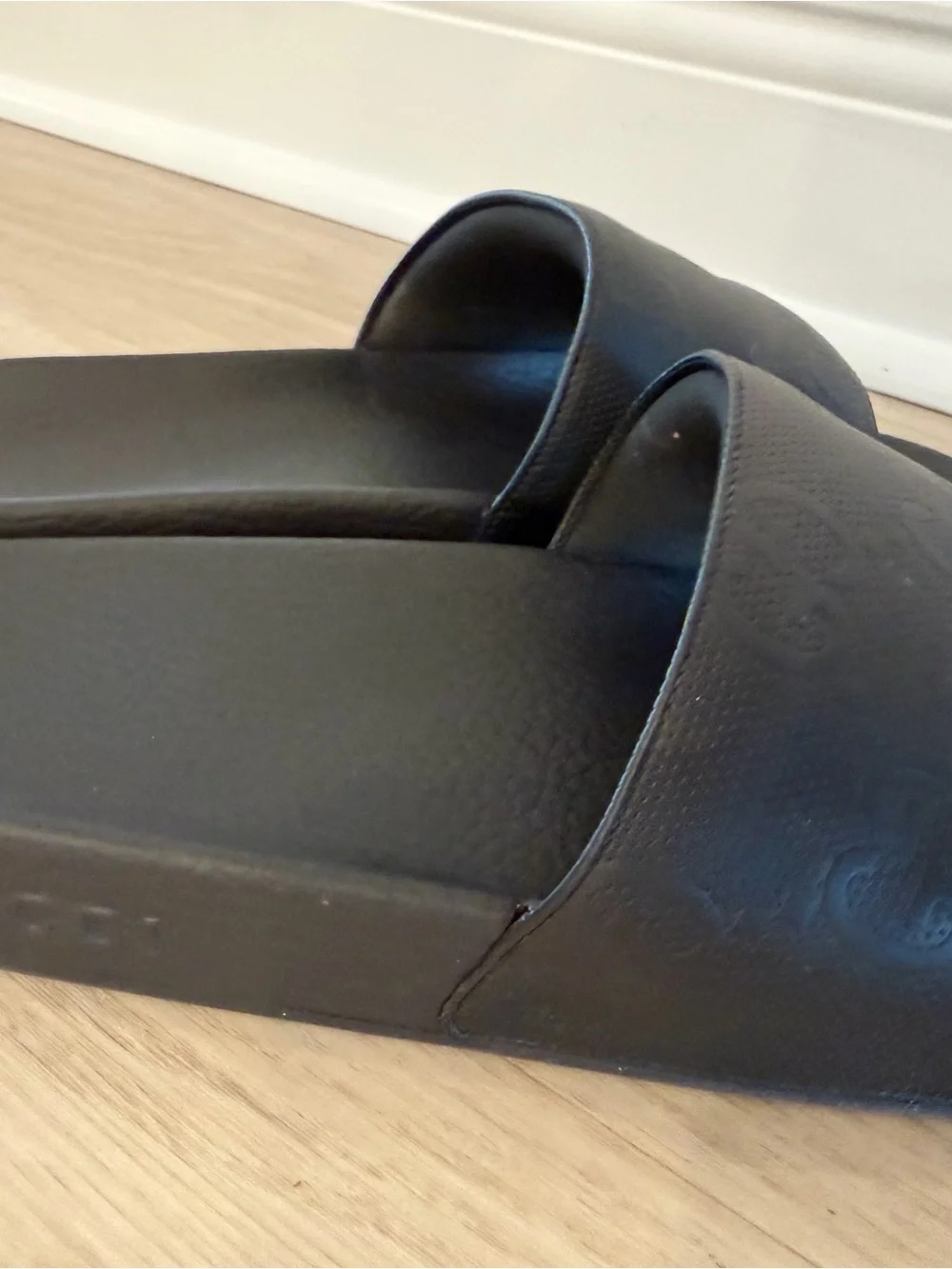 Men’s Gucci Black Embossed GG Slide Sandals